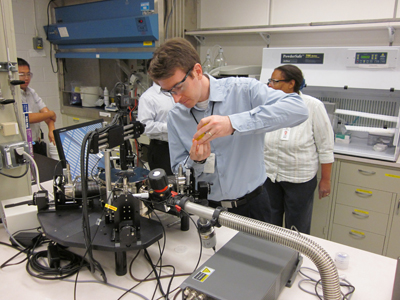 UK alum Joe Bullock works on equipment in the team's lab at the Phillips 66 Research Center.