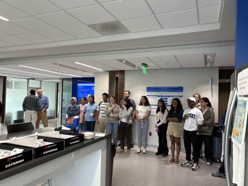 Students gather for the announcement of poster awards.
