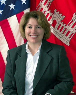 Color portrait of Elizabeth Ferguson with the American Flag in the background.